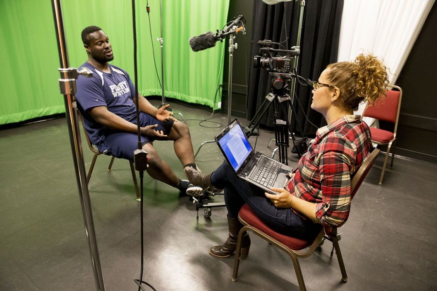 Tourse conducts a video interview with Adedire Fakorede '18 of Newark, N.J., in a studio at the Digital Media Studios. (Phyllis Graber Jensen/Bates College)