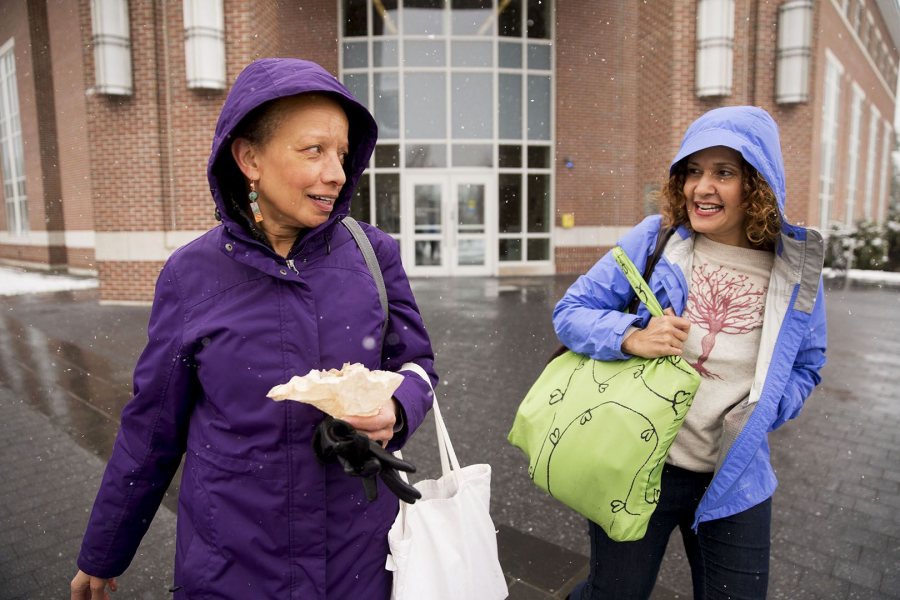 Tourse and Associate Professor of Politics Leslie Hill leave Pettengill Hall for the Den, where the two talked and had lunch (Phyllis Graber Jensen/Bates College)