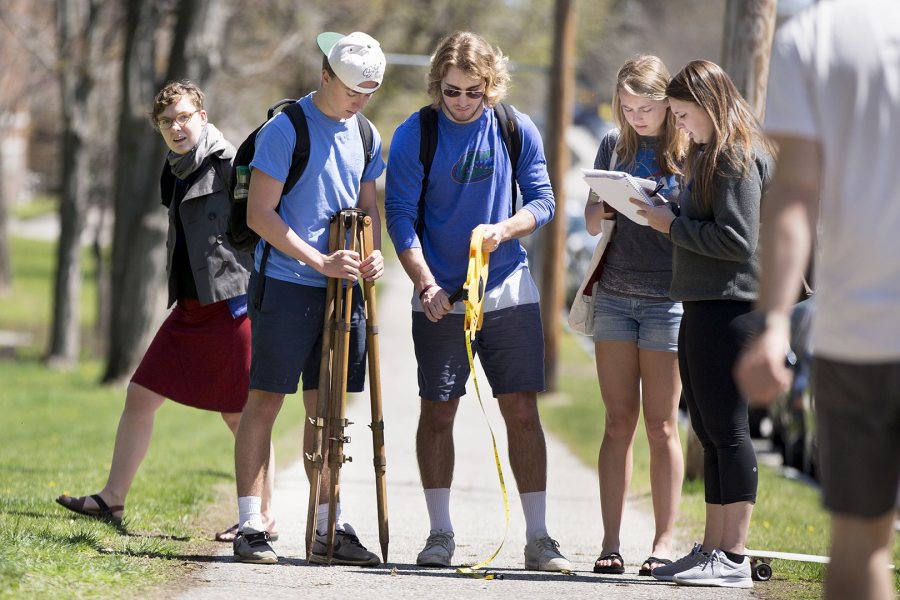 Visiting Assistant Professor of History Katherine McDonough, left, and members of her "Innovations in Mapping" class conduct a triangulation exercise on May 6, 2016. (Phyllis Graber Jensen/Bates College)