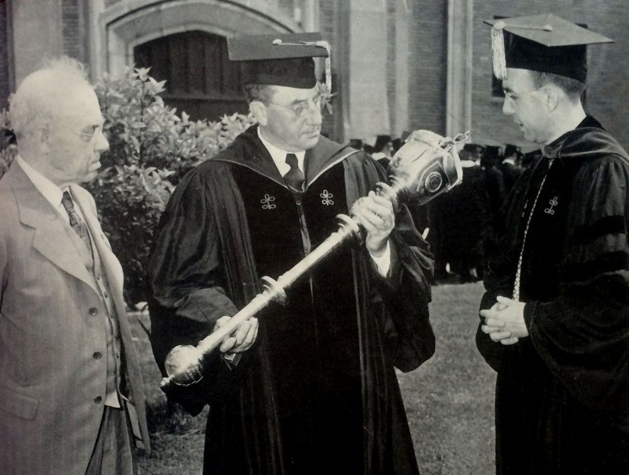 At Commencement 1949, Professor of Biology William Sawyer, Class of 1913, holds newly given mace as its creator, Leverett Cutten, Class of 1904, and President Charles Phillips look on. (Muskie Archives and Special Collections Library) 