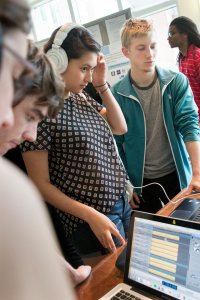 Listening to mixes by students in a music recording and production course taught by Jonathan Wyman '97. (Phyllis Graber Jensen/Bates College) 