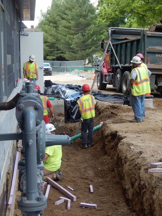 Shown on May 31, 2016, workers for Gendron & Gendron build a feature to divert stormwater runoff at 55 Campus Ave. (Doug Hubley/Bates College)