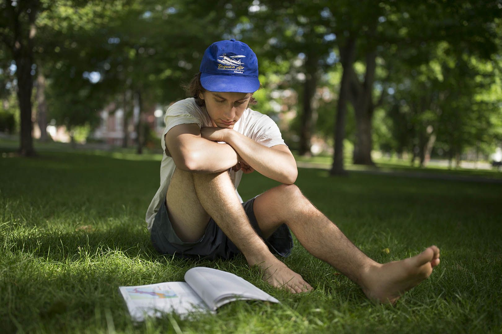 On the Historic Quad a few weeks ago, Jack Sapoch '18 of Hopewell, N.J., reads Ancient Rome: A New History by David Potter. Alas, that title didn't make it onto this year's list. But check out which ones did. (Phyllis Graber Jensen/Bates College)