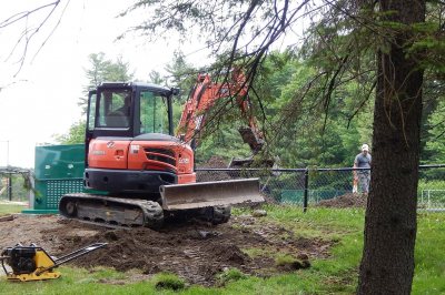 A crew from Thirsty Turf works on the Campus Avenue Field's new irrigation system on June 7, 2016. (Doug Hubley/Bates College) 