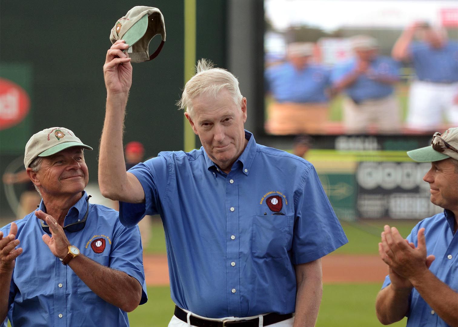 Thom Freeman '63 tips his hat as he and fellow Maine Baseball Hall of Fame inductees are honored at Hadlock Field in Portland during a minor league game between the Sea Dogs and 