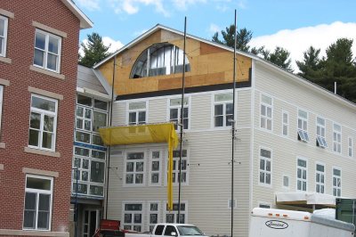 Like louvers do: This semi-circular hole in the center-section gable at 280 College Street will accommodate a ventilation louver. (Doug Hubley/Bates College)