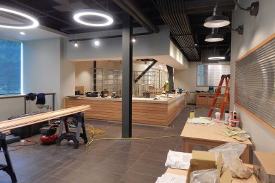 The Post & Print center, at 65 Campus Ave., shown on June 30, 2016. The wood on the sawhorses at left and the service counter at the rear is red oak, a decorative element much in evidence at 55 and 65 Campus. (Doug Hubley/Bates College)