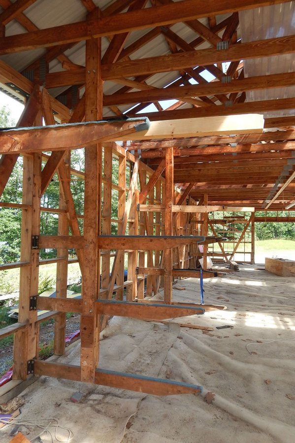 Topped with worn blue padding, the wooden boat racks were still in place in Bates' 1988 boathouse on July 19, 2016, about a week before its scheduled demolition. (Doug Hubley/Bates College)