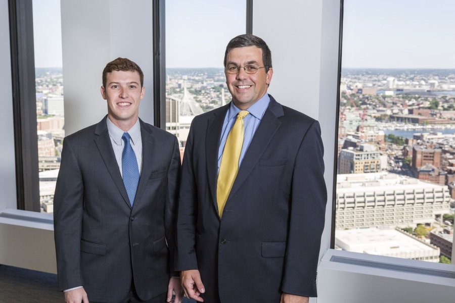 Mike Mulach '17 of Rocky River, Ohio, poses with his mentor, Brad Adams '92, during his Purposeful Work internship at TM Capital in Boston. In learning about mergers and acquisitions, Mulach says that “there's no paper pushing here. I'm doing everything a full-time person would do.” (Josh Kuckens/Bates College) 