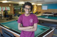 Cristopher Thompson '19 of Macon, Ga., poses for a portrait at the Boys and Girls Club of Auburn, where he worked with young people this summer supported by a fellowship from the Harward Center for Community Partnerships. (Josh Kuckens/Bates College)