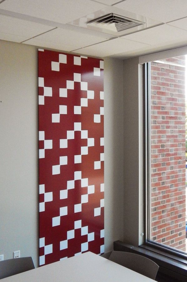 This wall piece, created in collaboration with Museum L-A from a vintage textile silkscreen, hangs in a study lounge at 55 Campus Ave. (Doug Hubley/Bates College)