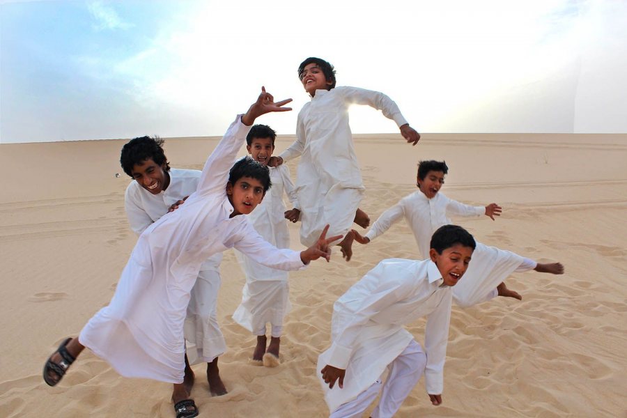 During the 2012 Short Term to Saudi Arabia, a group of Saudi boys cavort for the camera during a desert outing to the Eastern Province. (Photograph by Gintare Balseviciute ’13)