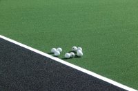 Field hockey balls on the GreenFields TX turf on Sept. 1, 2016, the second day of practice on the new surface. (Doug Hubley/Bates College)
