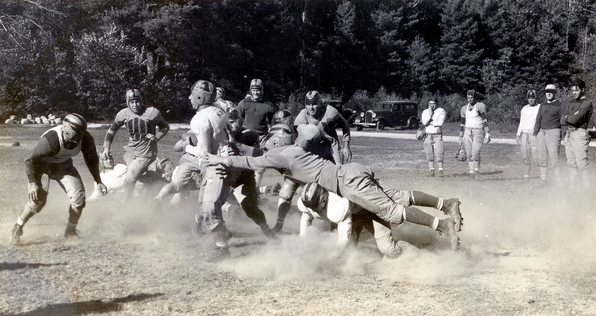 Bates football players do preseason drills at Camp Wonalancet in Easton Center, N.H. The year is likely 1939. (Photograph by Richard Bowers Oliver)