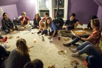 One discussion group gathers in the attic space, one of several extra rooms opened for the surge of Hearth attendance. 
