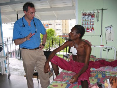 Dr. Edward O'Neil consults with a patient in Guyana. (Omnimed) 