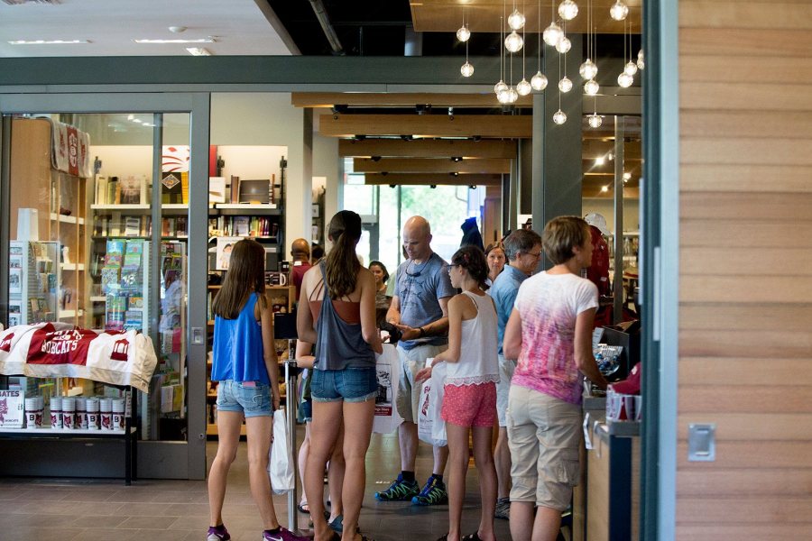 The presence of the College Store and Post & Print in Kalperis Hall brings a new density of Bates people to the south edge of campus. Here, members and families of the Class of 2020 stock up at the store in late August 2016. (Phyllis Graber Jensen/Bates College)