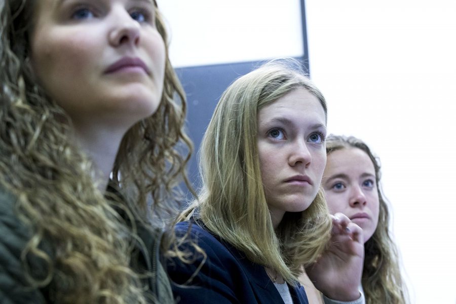 Playing the role of the GOP candidate, Molly Chisholm '17 is flanked by campaign workers Jacqueline Forney ’18, left, and Honor Moshay ’17 during a briefing on a public health crisis introduced into a mock presidential election in fall 2017. (Phyllis Graber Jensen/Bates College)