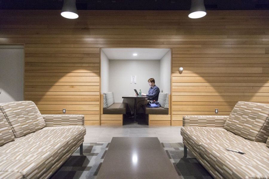 Students like Wenkai Han '17 of Beijing, China, working on his resume in a "niche" in Chu Hall, are using the creatively designed spaces in Chu Hall and Kalperis Hall in equally creative ways. (Josh Kuckens/Bates College) 