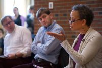 While fellow politics faculty John Baughman and Ben Moodie look on, Leslie Hill makes a point during the department's "What Just Happened?" election analysis on Nov. 9 in the Mays Center. (Phyllis Graber Jensen)