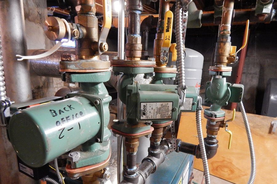 Zonal hot water circulating pumps in the basement of Bates Communications Plaza. (Doug Hubley/Bates College) 