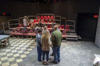 Actors in the production of <em>The Pillowman</em> gather  in their traditional circle before their dress rehearsal.