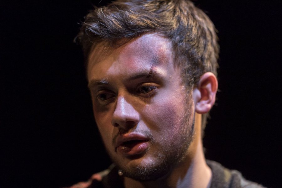 Nate Stephenson '18 of Ellsworth, Maine, performs a monologue in the Bates production of The Pillowman on Dec. 7, 2016. (Josh Kuckens/Bates College)