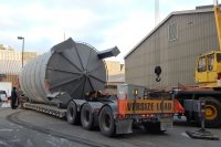 Tanks a lot: With a Cote crane poised for action, a rigger unfastens the Renewable Fuel Oil tank from its trailer on Dec. 9, 2016. (Doug Hubley/Bates College) 