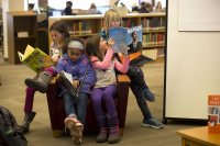 Children read books from the Picture Book Collection in Ladd Library during the college's 2017 Martin Luther King Jr. Day observance. (Phyllis Graber Jensen/Bates College) 