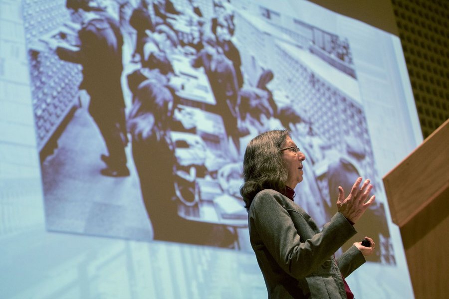 College Key Distinguished Alumna in Residence Susan Dumais '75 gives a talk on Feb. 1 in the Olin Arts Center Concert Hall in front of an image showing a bygone way to retrieve information: the card catalog. (Phyllis Graber Jensen/Bates College)