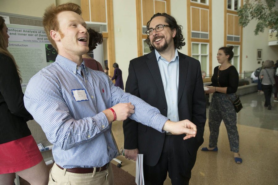 Ian Ramsey '16, a mathematics and biochemistry double major, laughs with Assistant Professor of Neurocience Jason Castro at the 2016 Mount David Summit. (Phyllis Graber Jensen/Bates)