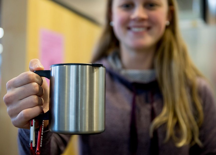 Mugging for the camera: Like every other Bates student on campus during Short Term, Laura Rand '18 of Barrington, R.I., will soon have a Personal Reusable Container like this to call her own. (Phyllis Graber Jensen/Bates College)
