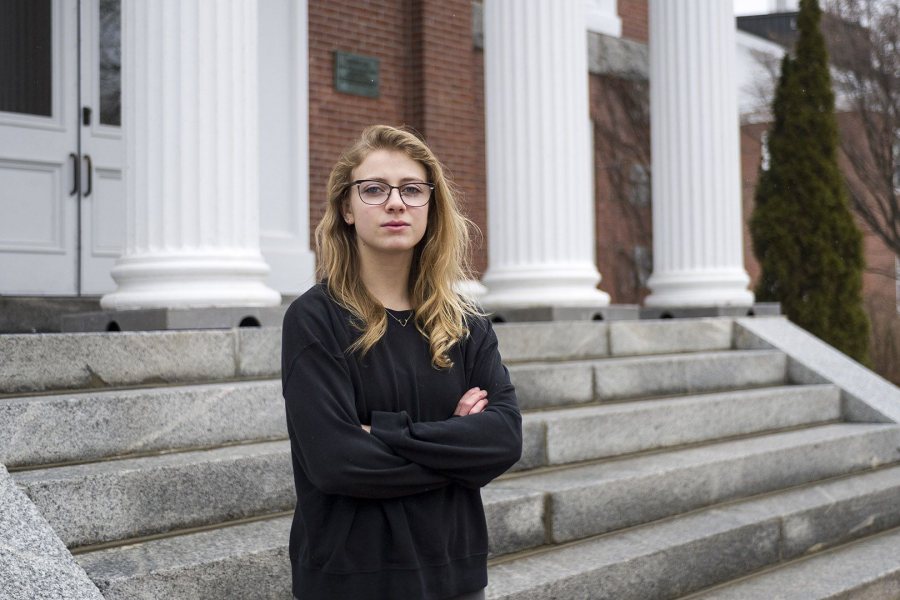 Kat Harling '17 poses outside Hathorn Hall, home of the Department of English, on March 29. (Josh Kuckens/Bates College)