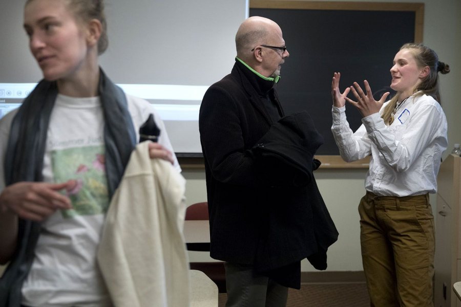 Woods Fairchild '18 of Boston, Mass., talks with Associate Professor of Russian Dennis Browne after her panel presentation. (Phyllis Graber Jensen/Bates College)