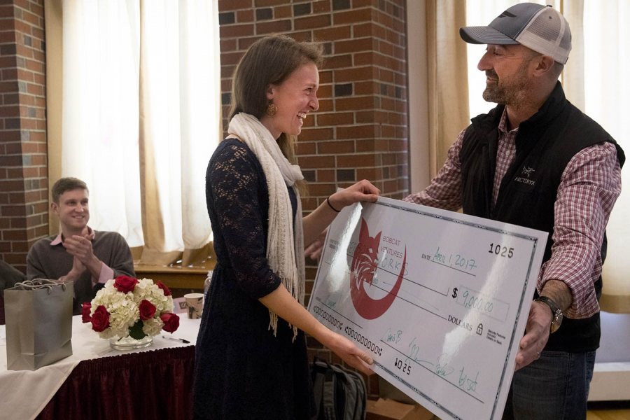 Bobcat Ventures judge Chris Barbin '93 presents first-place winner Ali Rabideau '17 with a check for $9,000 to support Herban Works. (Phyllis Graber Jensen/Bates College)