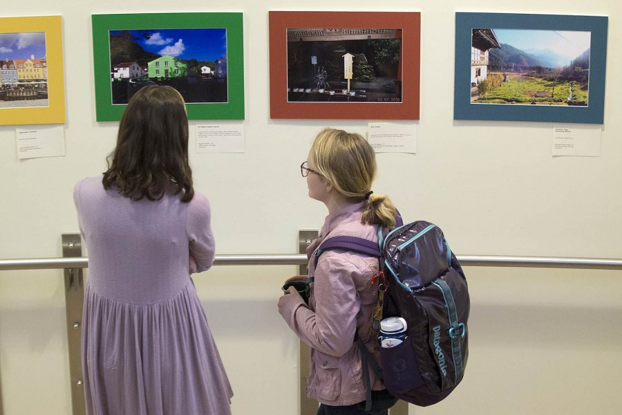 Students view images in the Barlow Off-Campus Photography Exhibition during Mount David Summit on March 31. (Phyllis Graber Jensen/Bates College)