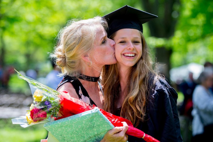 Jessica Wilson of Cumberland, Maine, receives a kiss from her proud mother, Julie Hanlon, after receiving a degree in environmental studies. (Phyllis Graber Jensen/Bates College)