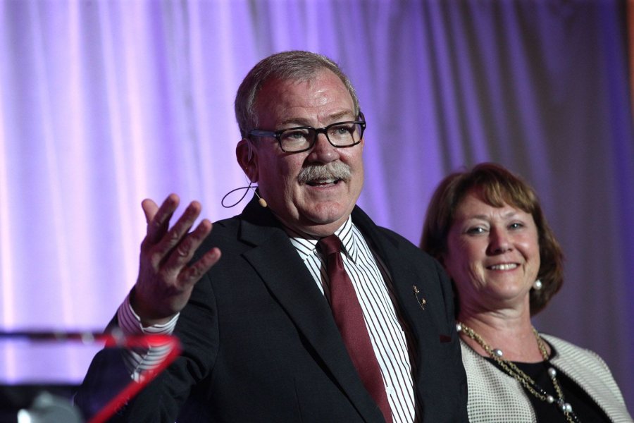 Mike Bonney '80 and Alison Bonney '80 take the stage to talk about their $50 million gift to Bates during Tuesday night's Bates Campaign kickoff in Boston. (Phyllis Graber Jensen/Bates College)