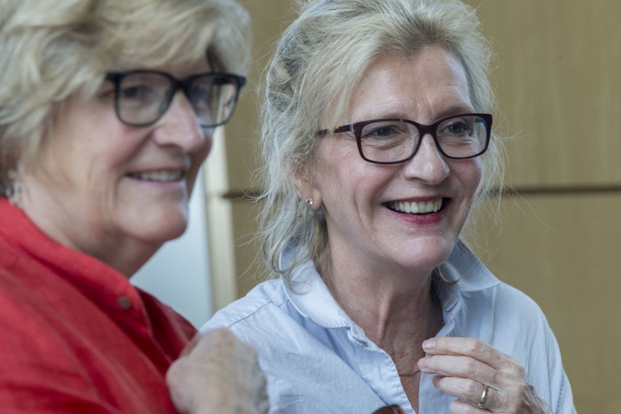 Pulitzer Prize–winning author Elizabeth Strout ’77 stands with President Clayton Spencer following their interview about Strout’s approach to writing, the role played by Bates and Maine, and Strout's latest book "Anything is Possible." The Reunion event was SRO in the Fireplace Lounge of Commons. (Phyllis Graber Jensen/Bates College) 