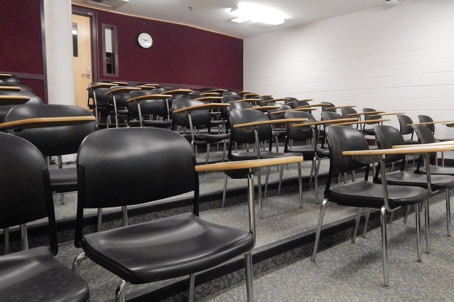 The tiered floor, the projection booth at left, and the white wall enclosing a storeroom will be removed to enlarge Carnegie 339. (Doug Hubley/Bates College)