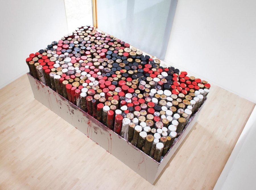 For "Roll in the Way," a work responding to the machismo of artists like Richard Serra, Kate Gilmore dipped more than 500 pieces of wood in paint and placed them on this platform. 