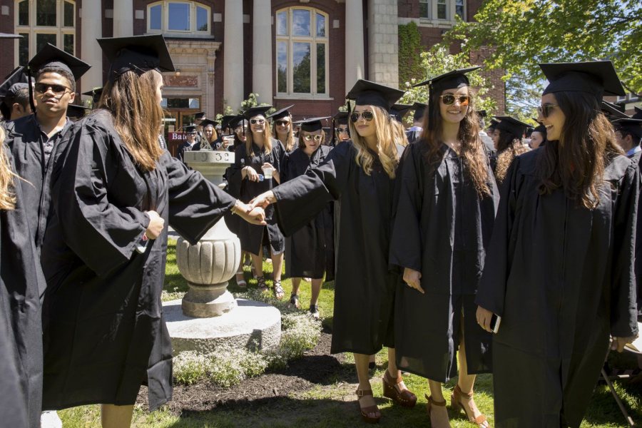 Seniors reach out to one another during Baccalaureate on May 27. (Phyllis Graber Jensen/Bates College)