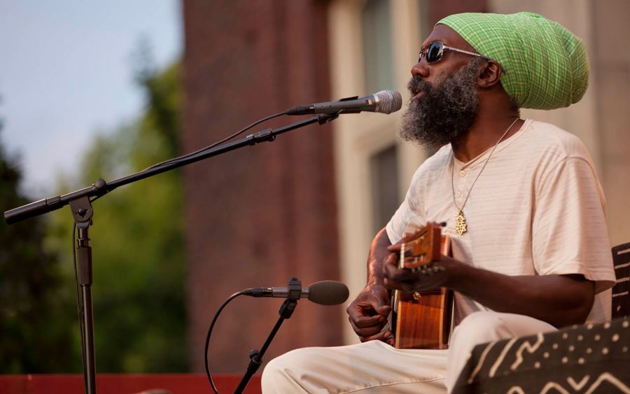 Shown in a 2013 Concert on the Quad at Bates, Corey Harris '91 brings his distinctive brand of roots music back to Bates on Sept. 24. (Phyllis Graber Jensen/Bates College)