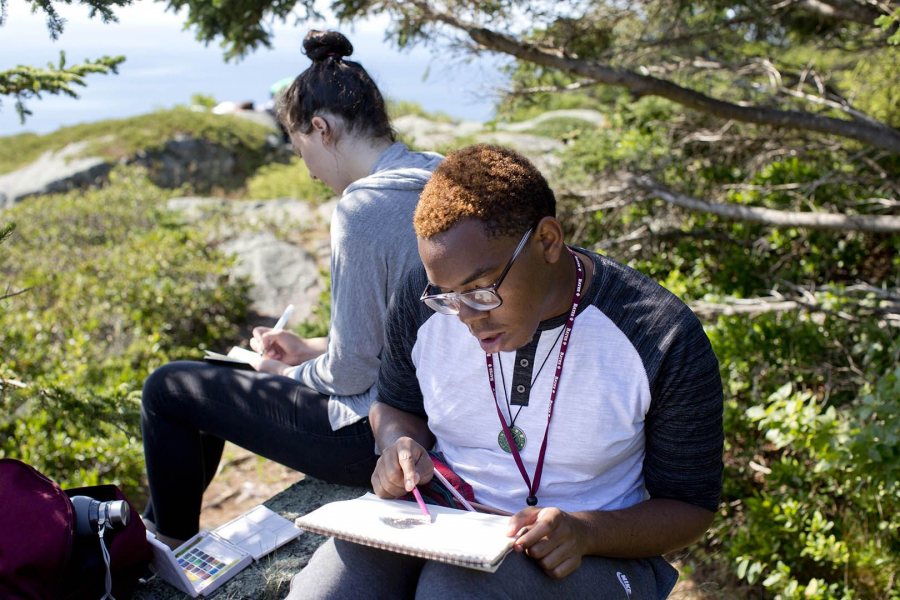 In 2015, Mickai Mercer ’19 of Philadelphia and a fellow first-year sit and sketch during their AESOP trip to the art colony on Monhegan Island. This year's Monhegan trip is "Art/Meditation" with: Olga Revzina '18 of Bethesda, Md., and John Ricatto '18 of Ridgewood, N.J. (Phyllis Graber Jensen/Bates College)