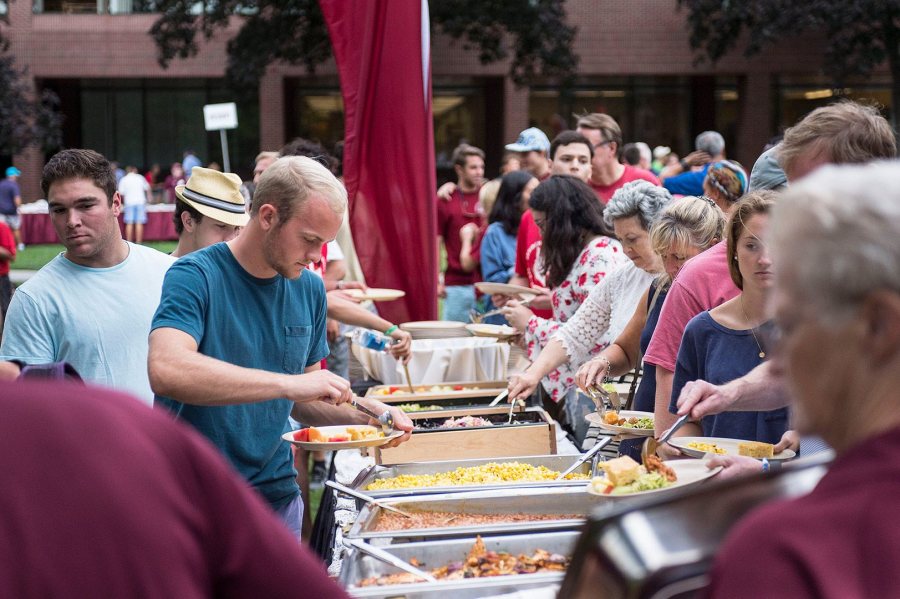 Shown in 2016, the Opening Day barbecue for new students and families is an annual tradition. The menu for 2017 includes pulled pork and chicken, chipotle tofu, and, this being Maine, three varieties of whoopie pies. (Josh Kuckens/Bates College)