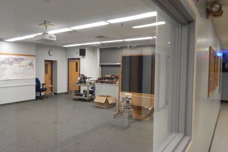 Awaiting "node chairs" and whiteboards is Carnegie 225, one of two refitted active-learning classrooms in the science building. The room is seen from a corridor through a new window intended to impart a sense of spaciousness. (Doug Hubley/Bates College) 