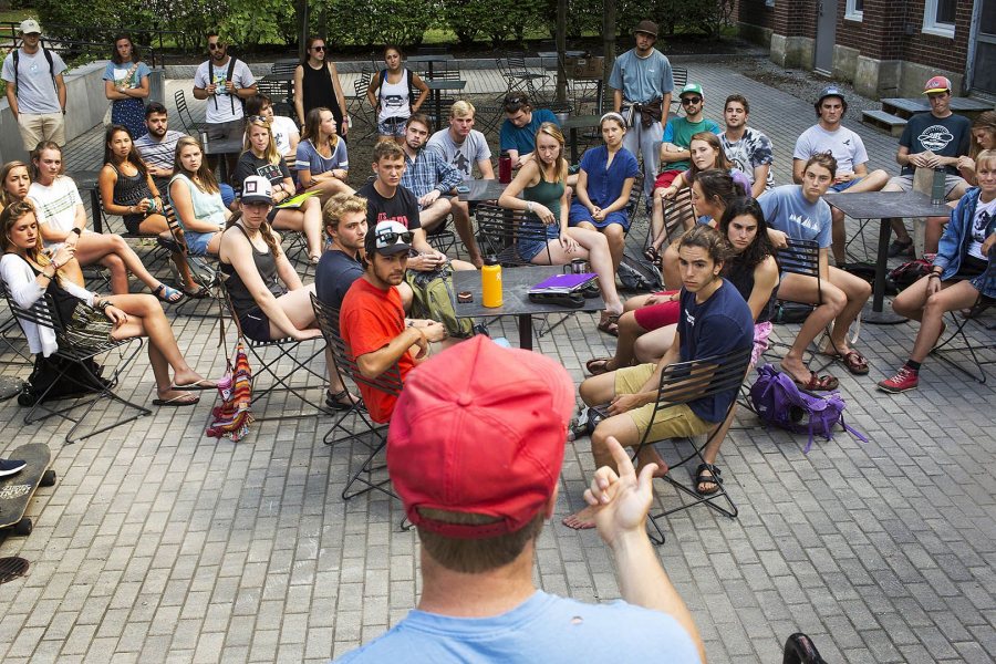 AESOP co-coordinator Kurt Niiler '18 of Freedom, N.H., demonstrates to AESOP trip leaders how to tie a bowline knot and a trucker's hitch knot during training outside of Chase Hall on Aug. 24. (Theophil Syslo/Bates College) 