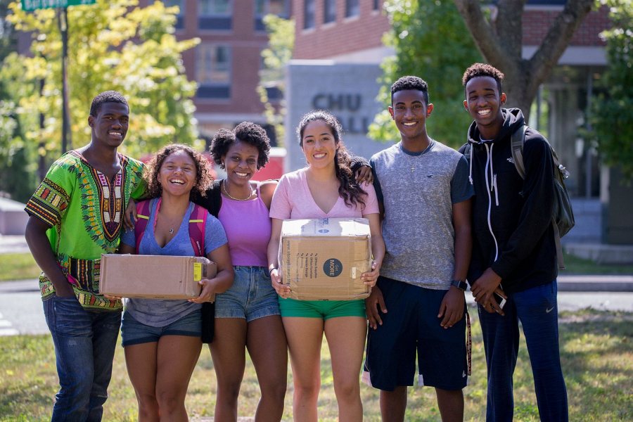 It's an impromptu meeting of Bobcats First! members from the Class of 2021 and program mentors on Campus Avenue on Aug. 24. From left: Kyle Larry '21 of Chicago, Samantha Alexander '20 of Menlow, Iowa, Doris Etienne '20 of Brooklyn, N.Y., Anais Gonzalez '20 of Hanford, Calif., Lebanos Mengistu '21 of Somerville, Mass., and Samatar Iman '21 of Auburn, Maine. (Phyllis Graber Jensen/Bates College)