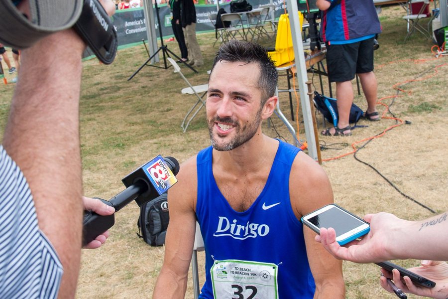 Rob Gomez '05 speaks to the Maine media after the Beach to Beacon on Aug. 5, 2017. (Photography by Ann)