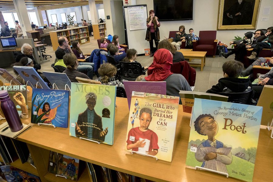 Author and illustrator Anne Sibley O'Brien reads from books in the Picture Book Collection in Ladd Library during the college's 2017 Martin Luther King Jr. Day observance. (Phyllis Graber Jensen/Bates College) 